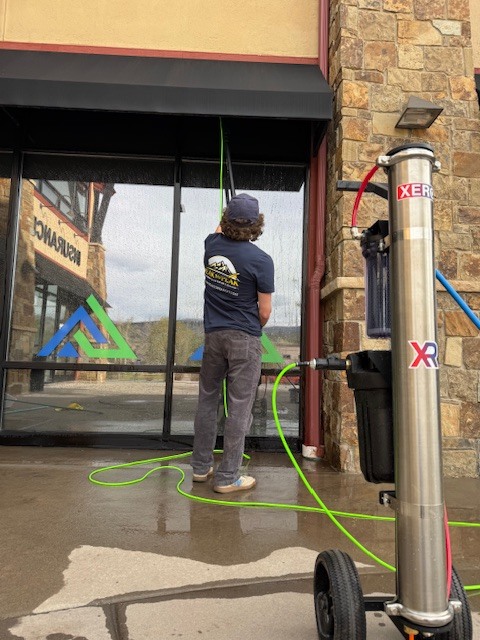 Purified water window cleaning on retail storefront in Vail Valley Colorado Purified water window cleaning on retail storefront in Vail Valley Colorado